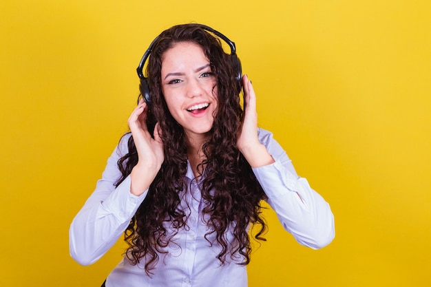 Woman listening to music on headphones lively happy joyful