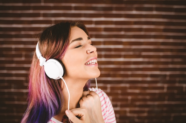 Woman listening music on headphones