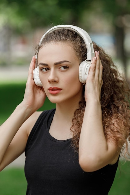 Woman listening to music on headphones