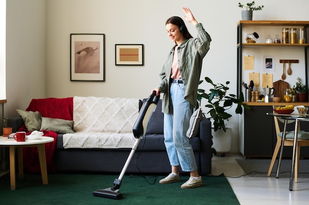 Woman listening to music during housework