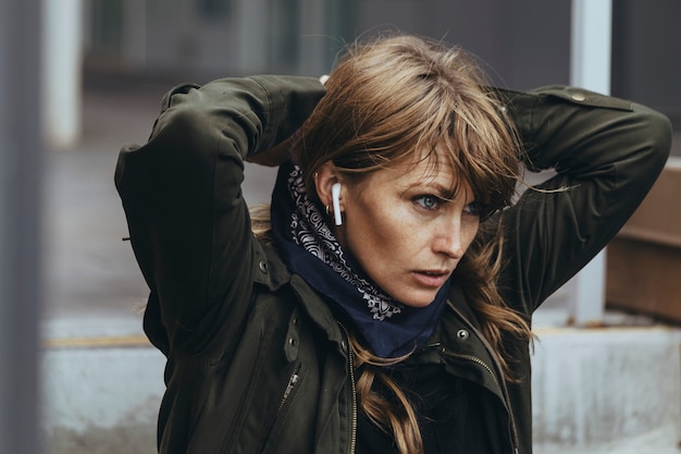 Woman listening to music on the steps