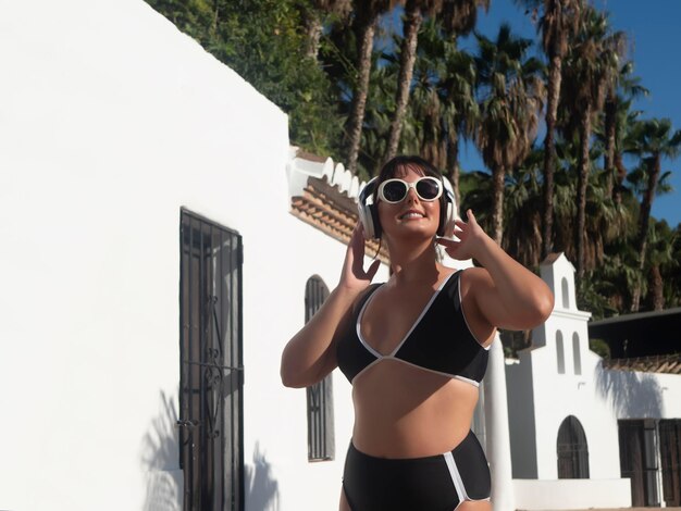 Woman listening to music during vacation