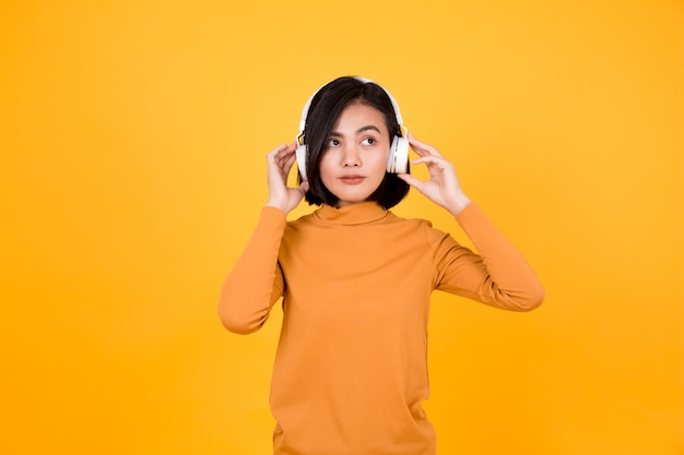 Woman listening to music with white headphones