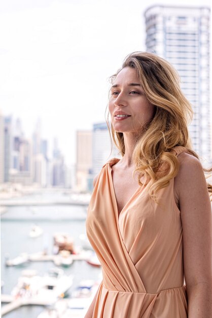 Woman in long dress at Dubai Marina