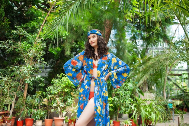 Woman in long summer pareo dress on exotic resort