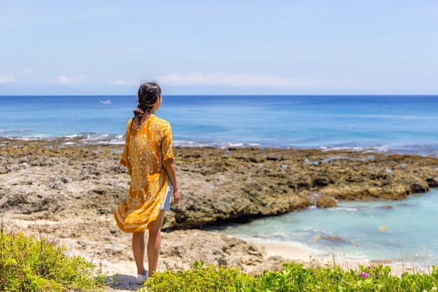 Woman look at the sea at summer time