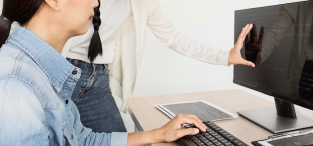 Woman looking at a blank desktop screen