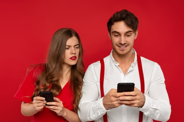 Woman looking at boyfriend smartphone