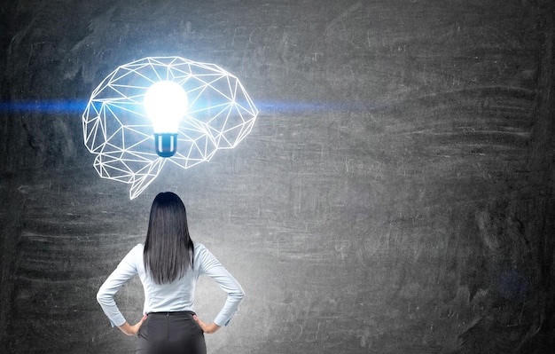 Woman looking at brain sketch