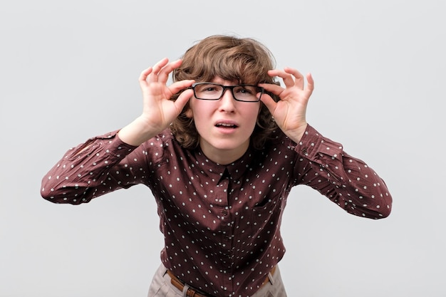 Woman looking carefully not believing her eyes