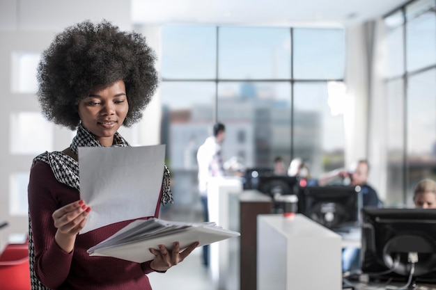 Woman looking at documents in office