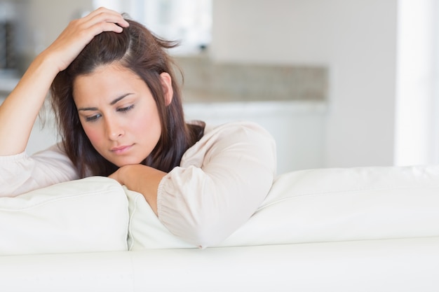 Woman looking down thoughtfully