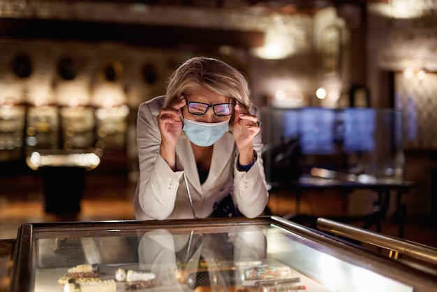 Woman looking expositions in museum