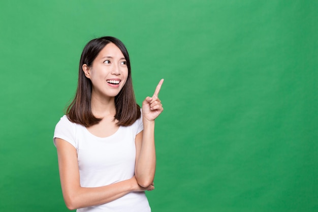 Woman looking at the finger pointing up