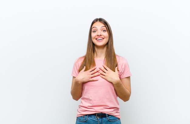 woman looking happy, surprised, proud and excited, pointing to self