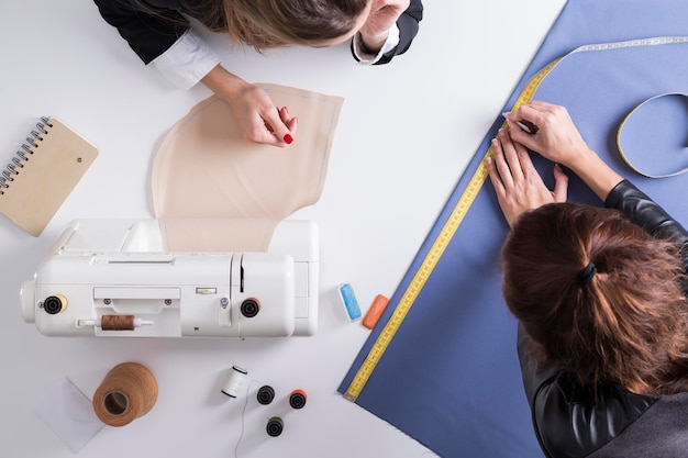 Woman looking at her colleague's work