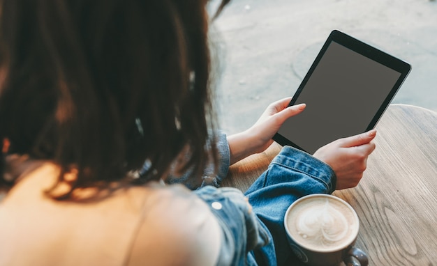 woman looking at her tablet