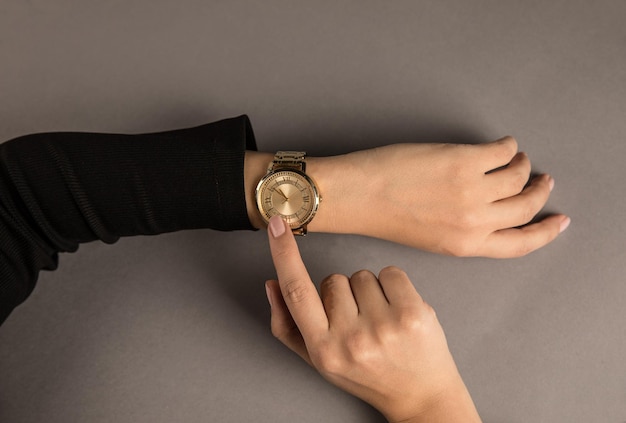 Woman looking at her watch