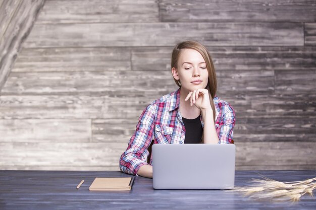 Woman looking at laptop