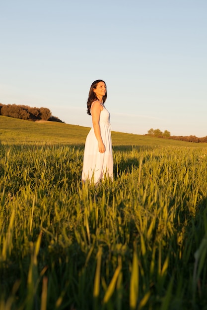 Woman looking at side relaxing on a meadow