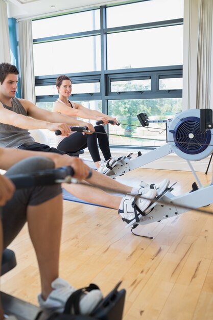 Woman looking up from rowing machine workout