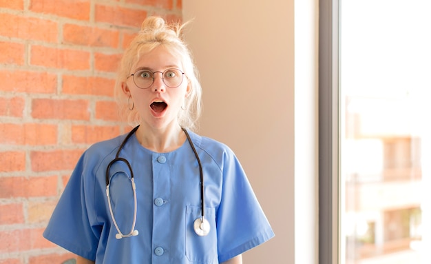 woman looking very shocked or surprised, staring with open mouth saying wow