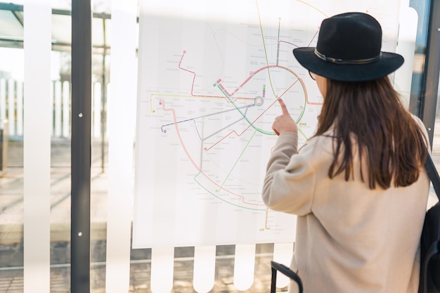 Woman looks at the city map