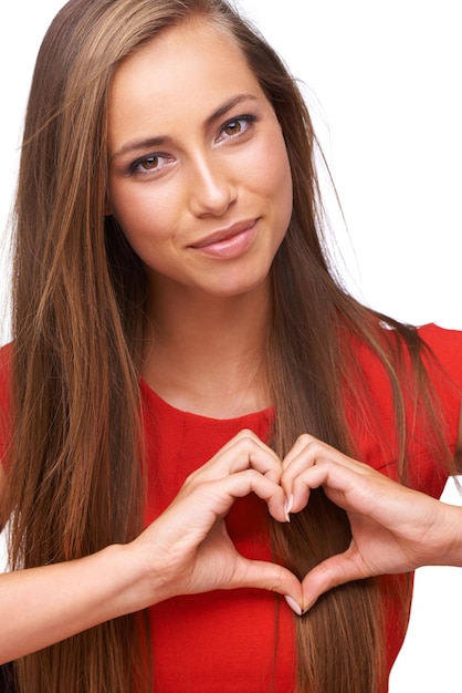 Woman love portrait and hands shape together for support peace and relax calm energy in white background Model face and heart symbol emoji icon sign and romance hand gesture isolated in studio