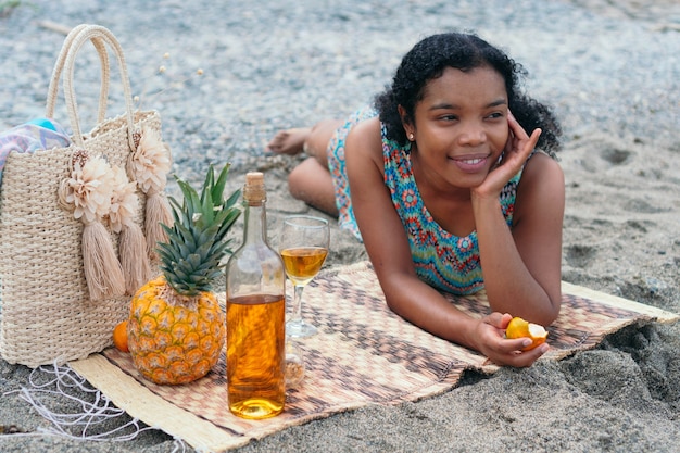 Woman lying on the beach enjoying a day at sea