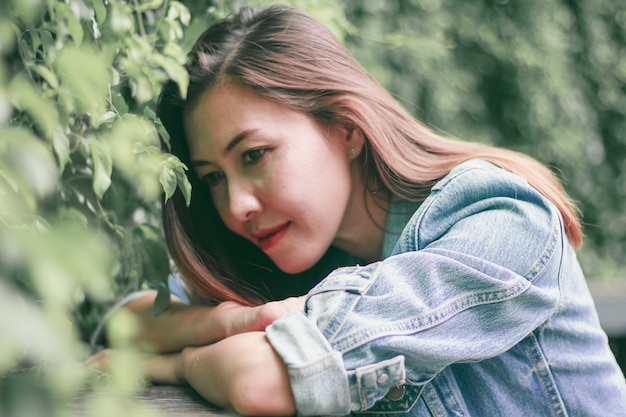 Woman lying down at the table in the park