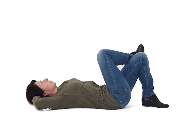 Photo woman lying on the floor looking up and legs crossed on white background