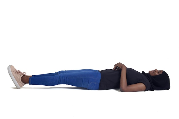 Woman lying on the floor looking up over white background