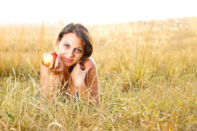 Woman lying in a meadow