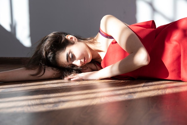 Woman lying in room ground