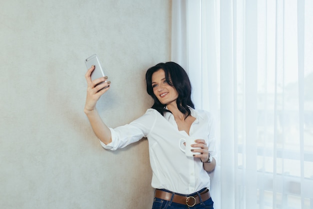 woman make selfie photo home