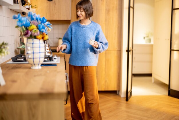 Woman makes a coffee at home