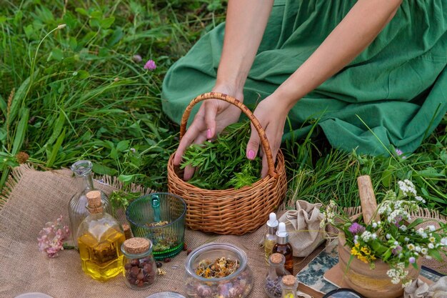 A woman makes herbal tincture Selective focus Nature