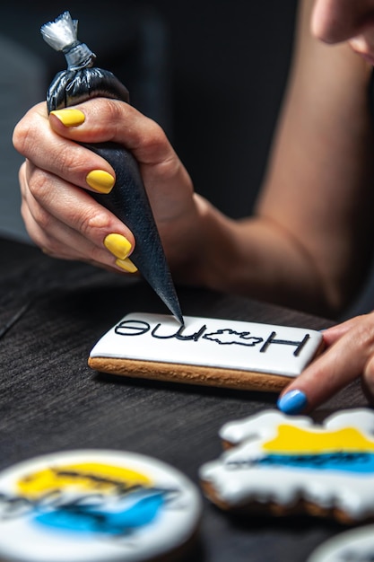 A woman makes patriotic gingerbread in support of ukraine