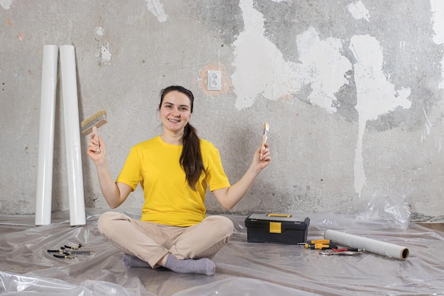 A woman makes repairs in the room