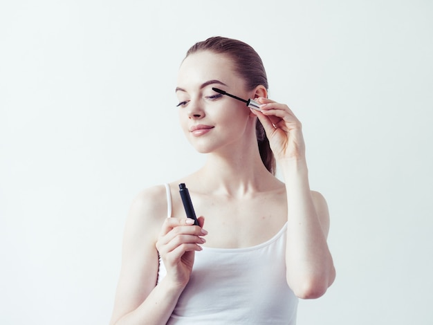 Woman makeup powder applying skin face  beautiful female natural portrait.