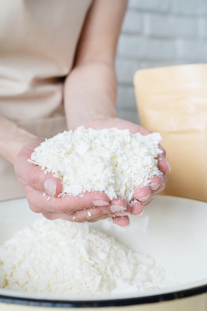 Woman making decorative aroma candles from soy wax