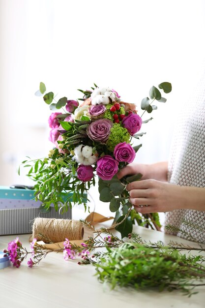 Woman making a flower bouquet