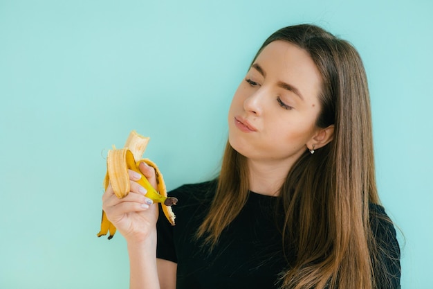 woman making fun with a banana.