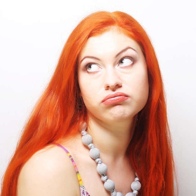 Woman making a funny face.Studio shot.