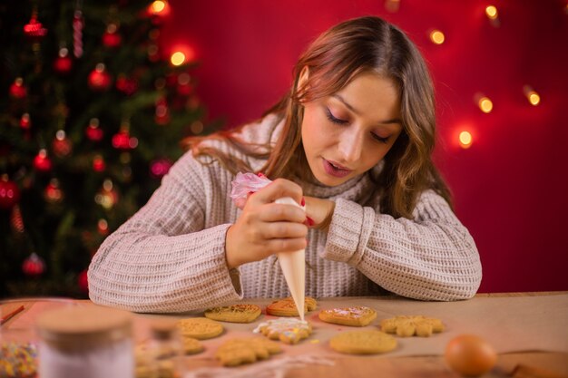 Woman making gingerbread cookies