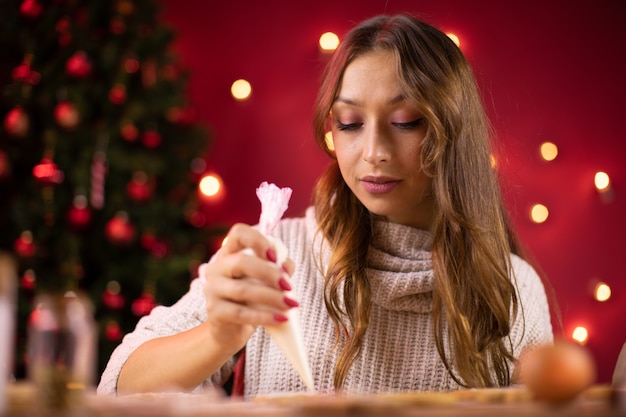 Woman making gingerbread cookies