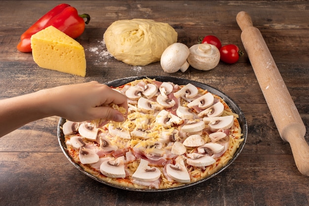 Woman making homemade pizza