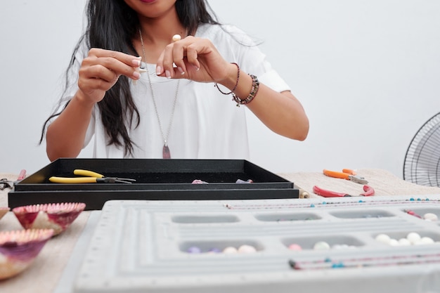 Woman making jewelry