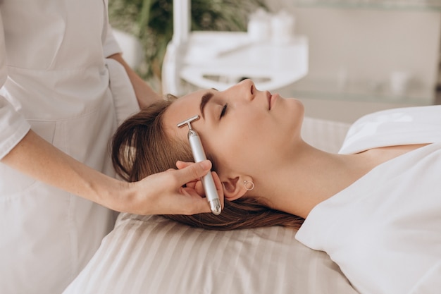 Woman making lifting procedures in a bauty salon