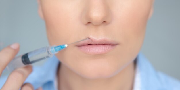 Woman Making a Lip Augmentation